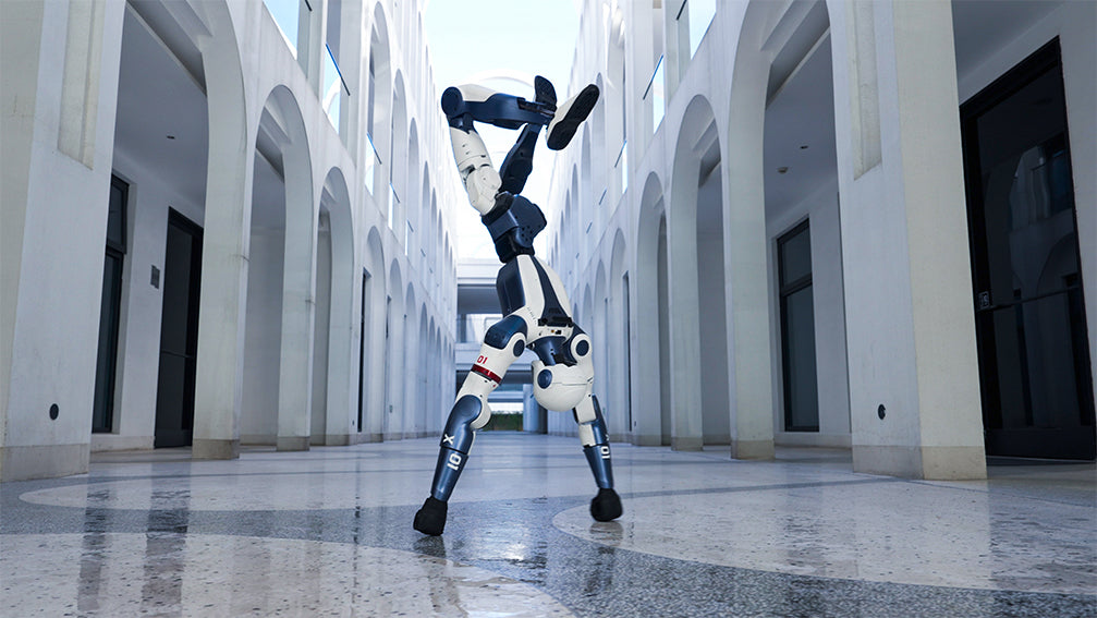 Unitree R1 Robot dance in a modern architectural setting with arched corridors